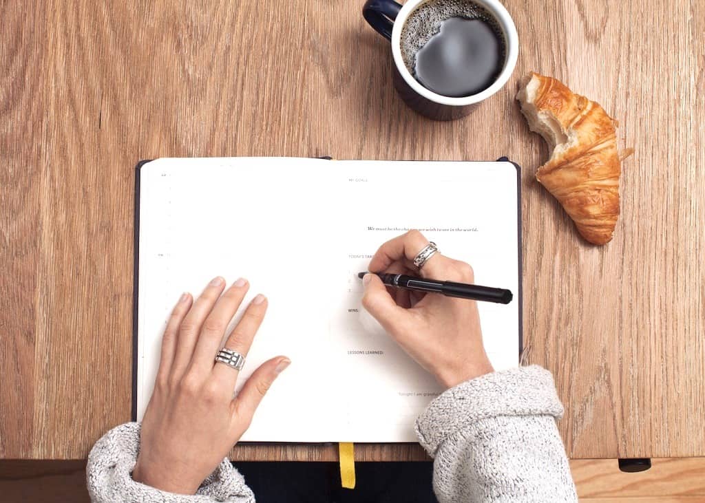 woman writing in journal