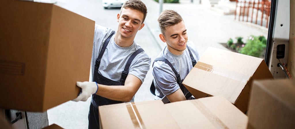 movers loading boxes in a truck