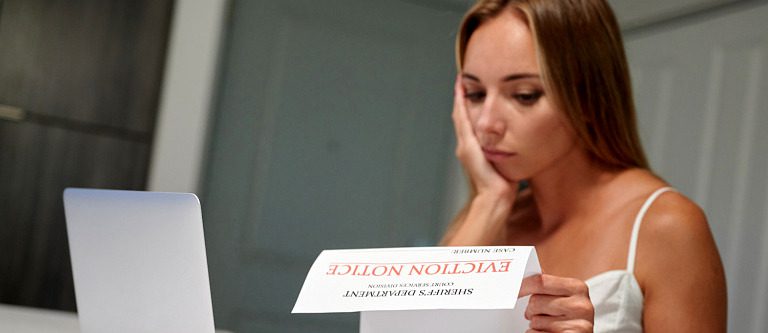 Woman reading eviction notice
