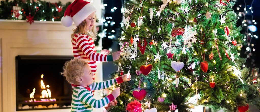 Kids decorating the Christmas tree