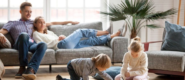 Family enjoying together time in their family room