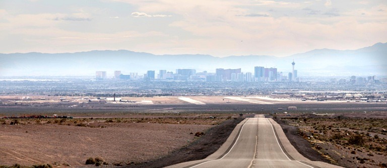 Desert road leading into North Las Vegas on a sunny day in Nevada