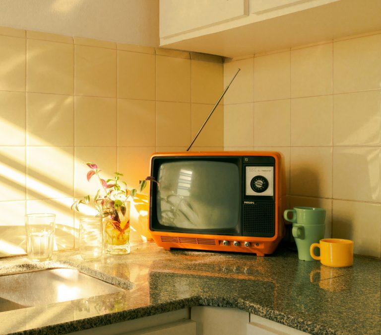 tv sitting on a kitchen counter